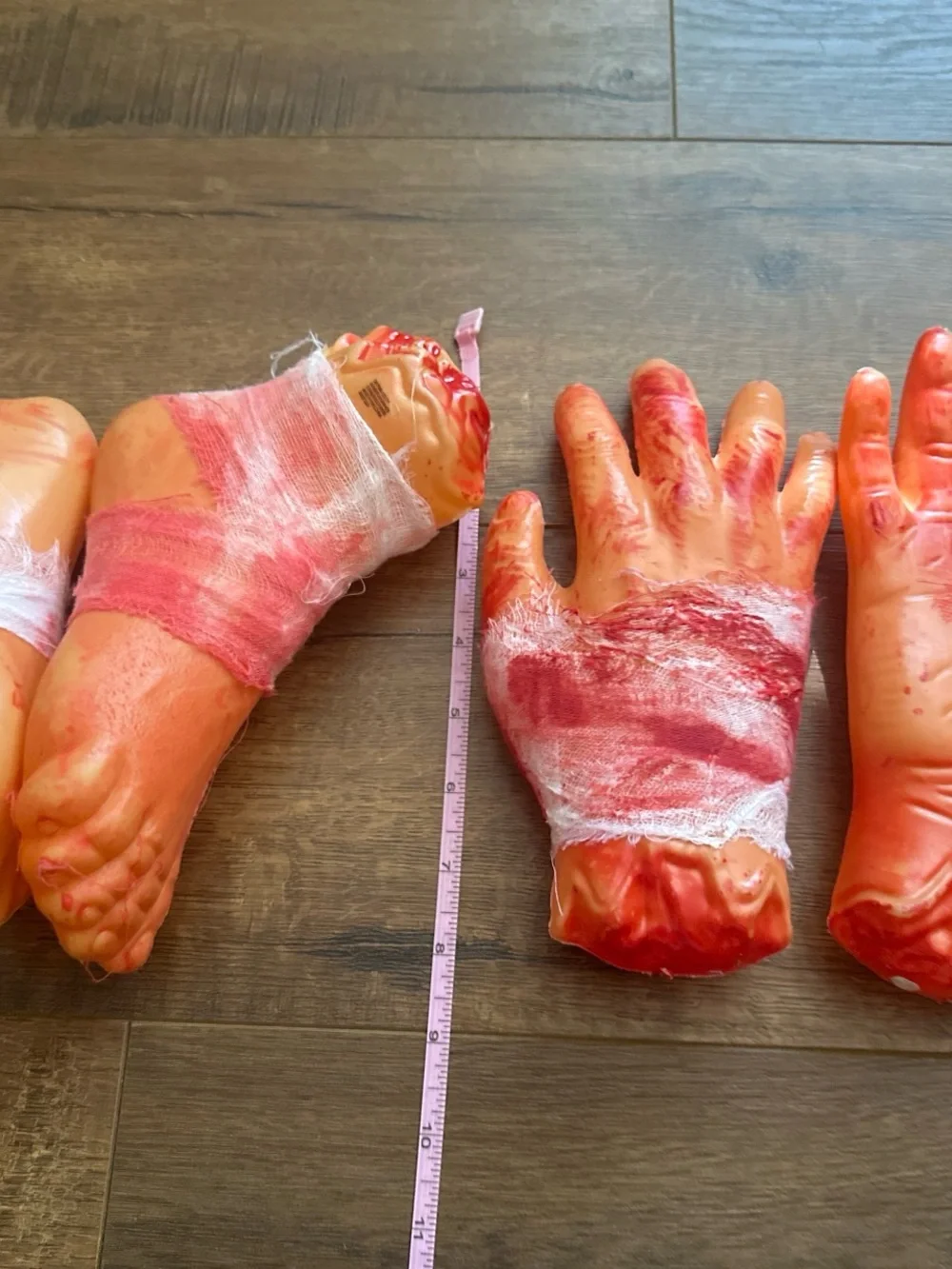 Fake Severed Hand and Foot Halloween Props - Bloody Orange Set